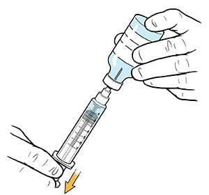 Closeup of hands filling syringe from bottle.