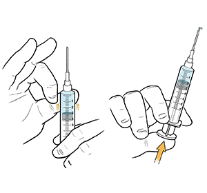 Closeup of hands removing air from syringe.