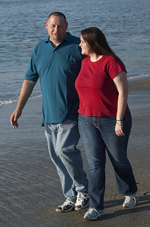 Couple walking on the beach.