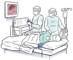 Man lying on exam table on side. Health care provider is holding end of colonoscope and looking at pictures on monitor. Another healthcare provider is standing next to table.