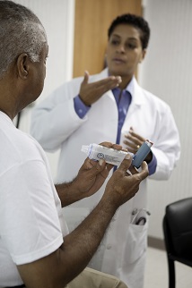 Doctor talking with male patient