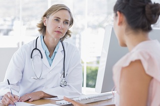 Doctor talking with woman