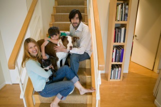 Family on stairs with pets