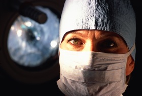 Female surgeon wearing a mask