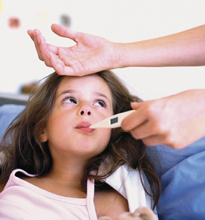 Girl with thermometer in her mouth.