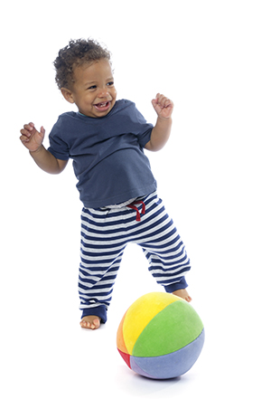 Happy baby playing with a ball.