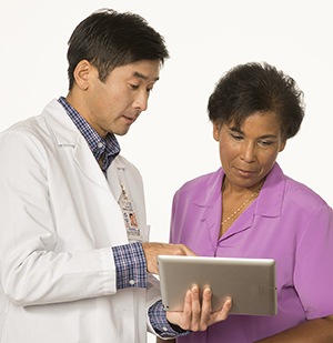 Healthcare provider talking to woman.