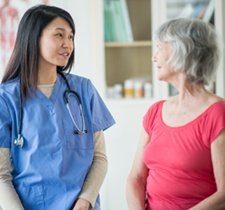 Healthcare provider talking with woman