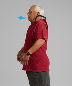 Man breathing out while doing shoulder roll exercise.