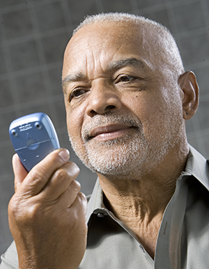 Man checking blood glucose