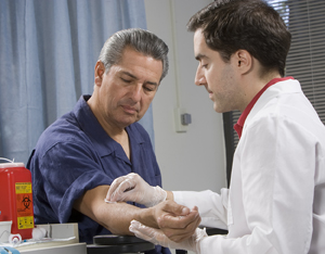 Man having blood drawn from his arm.