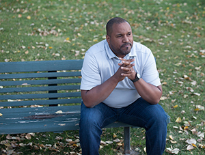 Man sitting on park bench. 