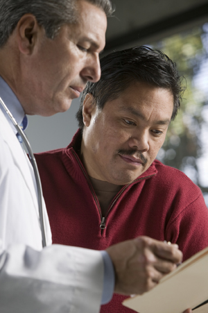 Man talking to doctor.