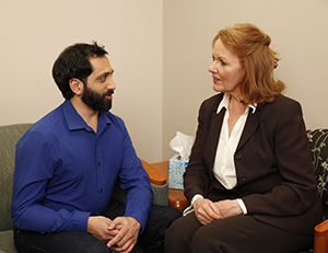 Man talking to mental health professional.