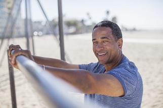 Man with hands on fitness bar