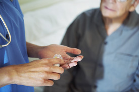 Nurse giving medication to patient