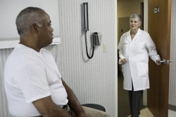 Older man and doctor in an exam room