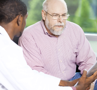 Older man talking with his doctor