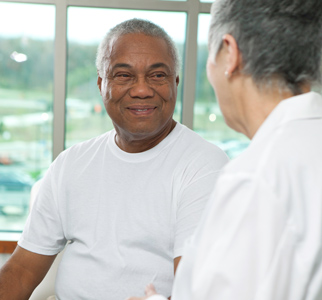 Older man talking with his doctor