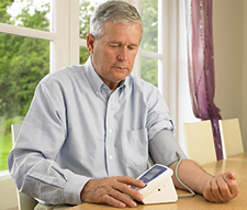 Senior man taking his blood pressure.