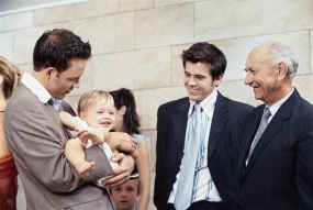 Three generations of males at a gathering