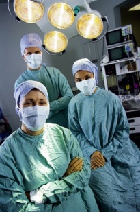 Three surgeons in a surgery suite