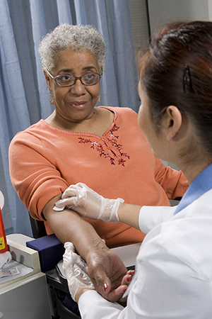 Woman having blood drawn.