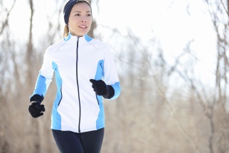 Woman jogging outdoors in cold weather