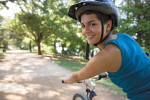 Woman riding bicycle.