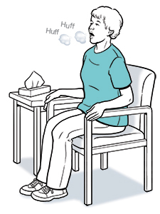 Woman sitting in chair, leaning slightly forward and coughing.