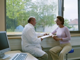 Woman talking with a doctor in an office