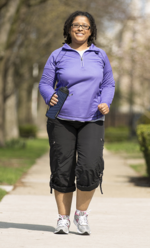 Woman walking outdoors.