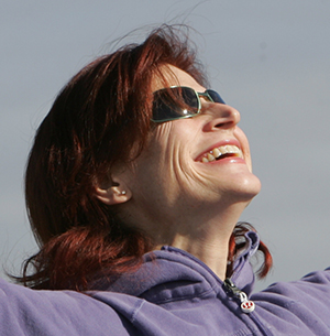 Woman wearing sunglasses outside.