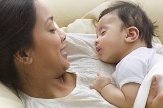 Woman with sleeping newborn