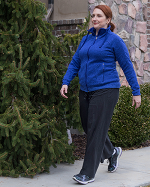 Woman walking outdoors.