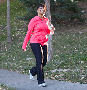 Woman walking in park.