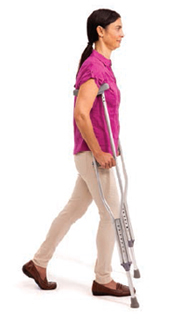 Woman walking with two crutches.