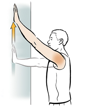 Man doing wall walk shoulder exercise.