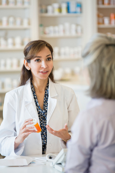 Pharmacist talking to a customer about a medication
