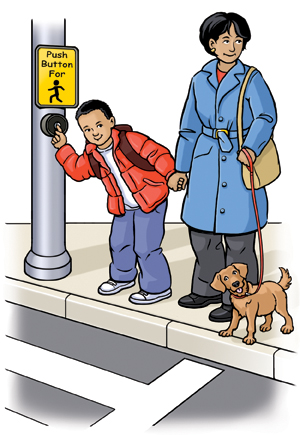 Woman and boy standing at street crossing holding hands. Boy is pressing button to cross street. Woman has dog on leash.